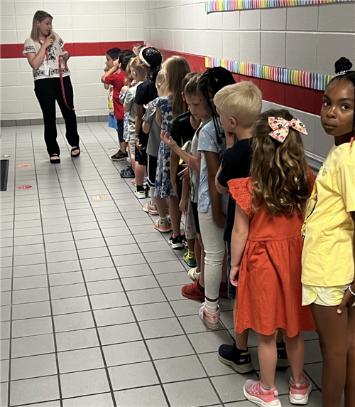 lineup of kids in hallway